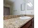 Bathroom featuring a vanity with granite countertop and white sink at 4050 Pacific Harbors Dr # 112, Las Vegas, NV 89121