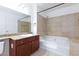 Bathroom with bathtub, shower, and vanity with granite countertop at 4050 Pacific Harbors Dr # 112, Las Vegas, NV 89121