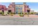 Charming condo building featuring desert landscaping and colorful stucco accents at 4050 Pacific Harbors Dr # 112, Las Vegas, NV 89121