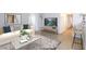 This stylish living room features a modern sofa, elegant decor, and wood-look flooring at 4050 Pacific Harbors Dr # 112, Las Vegas, NV 89121