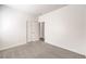 Carpeted room features an attached closet and access to ensuite bathroom at 4071 Blue Manor Ln, North Las Vegas, NV 89032