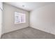 Carpeted room features a bright window and neutral walls at 4071 Blue Manor Ln, North Las Vegas, NV 89032