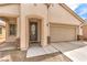 Charming single-story home featuring a low maintenance front yard and attached two car garage at 4071 Blue Manor Ln, North Las Vegas, NV 89032