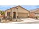 Charming single-story home featuring a low maintenance front yard and attached two car garage at 4071 Blue Manor Ln, North Las Vegas, NV 89032