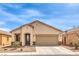 Charming single-story home featuring a low maintenance front yard and attached two car garage at 4071 Blue Manor Ln, North Las Vegas, NV 89032