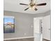 Bedroom featuring wood look flooring, ceiling fan, and natural light from a window at 45 Maleena Mesa St # 1424, Henderson, NV 89074