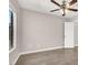 Comfortable bedroom featuring wood look flooring and a ceiling fan at 45 Maleena Mesa St # 1424, Henderson, NV 89074