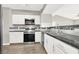 Modern kitchen featuring white cabinets, stainless steel appliances, and granite countertops at 45 Maleena Mesa St # 1424, Henderson, NV 89074