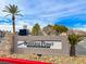 Traverse Point Condominiums sign surrounded by decorative rock, shrubbery, and Palm Trees at 45 Maleena Mesa St # 1424, Henderson, NV 89074