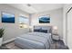 Comfortable bedroom featuring neutral walls, a window, and artwork on the walls at 4630 Adonis Blue St, North Las Vegas, NV 89031
