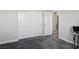 This bedroom offers a closet, door, and plush carpet at 4630 Adonis Blue St, North Las Vegas, NV 89031