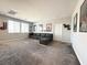 Spacious bonus room with comfortable seating, wall decor, and ample natural light from multiple windows at 4630 Adonis Blue St, North Las Vegas, NV 89031