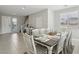 Dining area featuring a dining table with seating for eight, ideal for hosting gatherings at 4630 Adonis Blue St, North Las Vegas, NV 89031