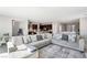 Open concept living room with spacious design and seamless flow to kitchen with modern finishes at 4630 Adonis Blue St, North Las Vegas, NV 89031