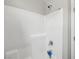 Modern shower with white tiles and chrome fixtures offers a clean design at 4630 Adonis Blue St, North Las Vegas, NV 89031