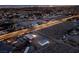 This aerial view captures a spacious property with pool and well-lit outdoor basketball court and storage building at 5315 N Fort Apache Rd, Las Vegas, NV 89149