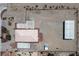 Aerial view from above showing layout of buildings: house, basketball court, metal outbuilding, all on large lot at 5315 N Fort Apache Rd, Las Vegas, NV 89149