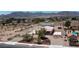 Views of a large lot with single story house, basketball court, metal outbuilding, and inground pool in neighborhood at 5315 N Fort Apache Rd, Las Vegas, NV 89149