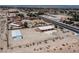 Aerial shot features a large lot, single story house, and basketball court, near community neighborhood homes at 5315 N Fort Apache Rd, Las Vegas, NV 89149