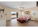 Bedroom features a sliding glass door to the exterior, a ceiling fan, and an upholstered headboard at 5315 N Fort Apache Rd, Las Vegas, NV 89149