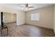 Spacious bedroom with updated floors, natural light, and large mirrored closet at 5315 N Fort Apache Rd, Las Vegas, NV 89149