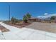 Exterior view showcasing a single-story home with desert landscaping and mountain views in the background at 5315 N Fort Apache Rd, Las Vegas, NV 89149