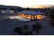 The exterior features a well-lit basketball court and spacious back yard with a large shop/garage space at 5315 N Fort Apache Rd, Las Vegas, NV 89149