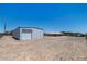 The home's backyard features a metal building and a wide open space at 5315 N Fort Apache Rd, Las Vegas, NV 89149