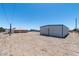 View of the property featuring a metal building with a basketball hoop at 5315 N Fort Apache Rd, Las Vegas, NV 89149