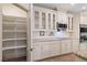 Well-equipped kitchen with custom cabinets, granite countertops, stainless steel appliances, and walk-in pantry at 5315 N Fort Apache Rd, Las Vegas, NV 89149