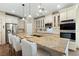 Spacious kitchen features an expansive island, stainless appliances, granite countertops and custom cabinetry at 5315 N Fort Apache Rd, Las Vegas, NV 89149