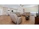 Open-concept living area with a view of the kitchen, complete with modern appliances, and comfortable seating at 5315 N Fort Apache Rd, Las Vegas, NV 89149