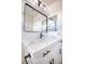Bathroom vanity features modern black hardware, quartz countertop, and a sleek faucet at 5345 Tustin Hills St, North Las Vegas, NV 89081