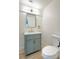 Bathroom featuring modern vanity with gold hardware and wood-look flooring at 5345 Tustin Hills St, North Las Vegas, NV 89081