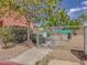 Fenced in dog park with lush green trees and plenty of space for dogs to play at 5345 Tustin Hills St, North Las Vegas, NV 89081