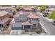 This two-story house has a red tiled roof, solar panels, and a well maintained front yard at 5345 Tustin Hills St, North Las Vegas, NV 89081