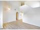 Sun-filled living room with vaulted ceilings, hardwood floors, and an open floor plan at 5345 Tustin Hills St, North Las Vegas, NV 89081
