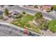 This aerial view showcases a community park, featuring lush grass and various playground equipment at 5345 Tustin Hills St, North Las Vegas, NV 89081