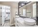 Modern bathroom with double vanity, elegant fixtures, and walk-in shower at 5436 Red Sun Dr, Las Vegas, NV 89149