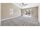 Bright bedroom with plush carpeting and direct access to the backyard pool area at 5436 Red Sun Dr, Las Vegas, NV 89149