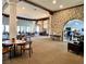 Spacious dining area with stone accent wall, classic furnishings, and an open floor plan at 5436 Red Sun Dr, Las Vegas, NV 89149