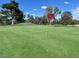 Scenic golf course view with lush green fairway and mature trees at 5436 Red Sun Dr, Las Vegas, NV 89149