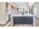 Modern kitchen featuring stainless steel appliances, white cabinets, and a center island at 5436 Red Sun Dr, Las Vegas, NV 89149
