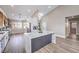 Spacious kitchen with a large island, stainless steel appliances, white cabinets, and recessed lighting at 5436 Red Sun Dr, Las Vegas, NV 89149