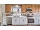 Updated kitchen with stainless steel appliances, stylish backsplash, and quartz countertops at 5436 Red Sun Dr, Las Vegas, NV 89149