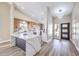 Modern kitchen with stainless steel appliances and an island with a quartz countertop at 5436 Red Sun Dr, Las Vegas, NV 89149