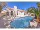 Inviting backyard pool with well maintained landscaping and a charming exterior at 5436 Red Sun Dr, Las Vegas, NV 89149
