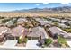 Aerial view of neighborhood featuring desert landscape and mountain backdrop at 5500 E Volterra Dr, Pahrump, NV 89061
