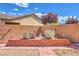 Zen desert landscaped backyard with brick planters and meditative statue at 5500 E Volterra Dr, Pahrump, NV 89061