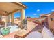 Relaxing covered patio with an outdoor grill, perfect for entertaining guests at 5500 E Volterra Dr, Pahrump, NV 89061